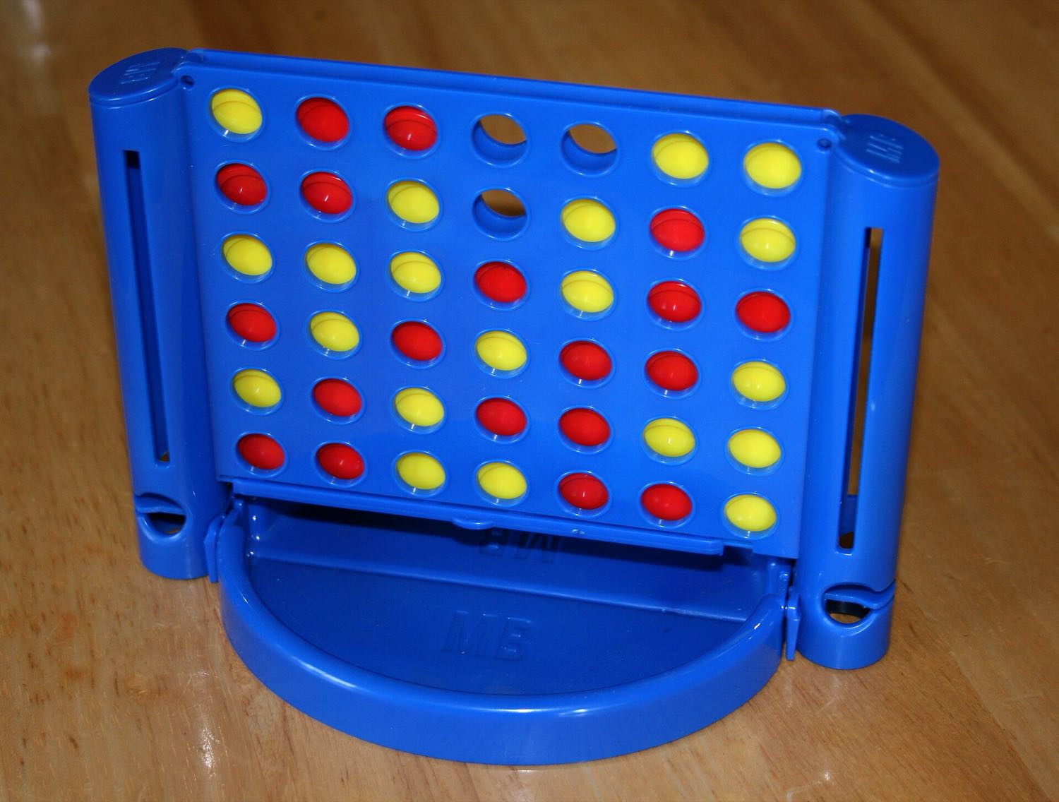 A Connect Four grid mid-game, red and yellow discs